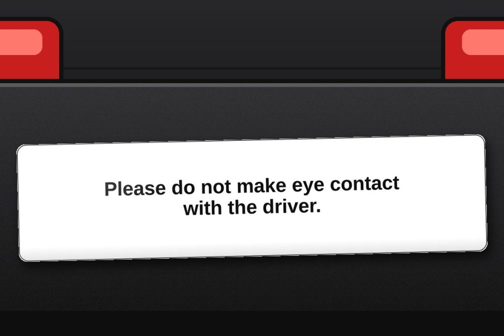 Please do not make eye contact with the driver. bumper sticker on a car bumper